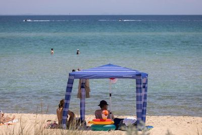 Saving a spot: how Australia’s beach cabana conundrum exposes a battle over long-held ideals