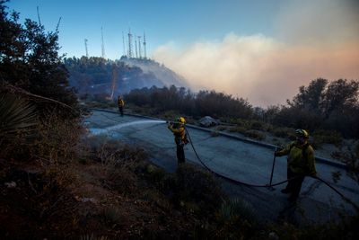 Los Angeles faces more fire evacuations even as fierce winds ease