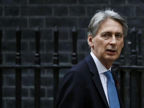Chancellor Philip Hammond indicates President Donald Trump could damage economic prosperity