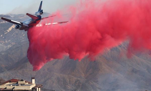 California fires live: progress made against some LA blazes but thickening smoke prompts ‘health emergency’