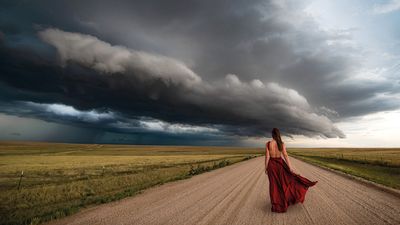 "There's not much foreground to be found when photographing storms – apart from old barns and livestock – so adding a human element brings a photo to life, especially a flowing red dress"