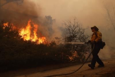 Firefighters Battle Treacherous Conditions In Palisades Fire Containment Efforts