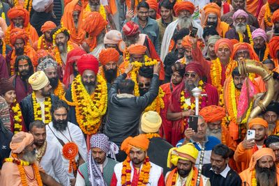 Tens of thousands of Hindu devotees take holy dip at largest gathering of humanity on Earth