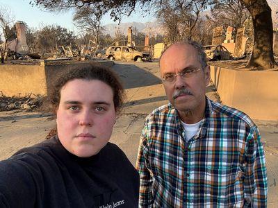 A dad and daughter help evacuees learn whether their homes survived the California wildfires