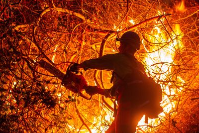 Fire crews race to contain Los Angeles wildfires as death toll rises to 24