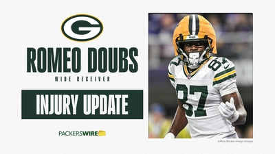 Packers WR Romeo Doubs evaluated for another concussion after hard fall