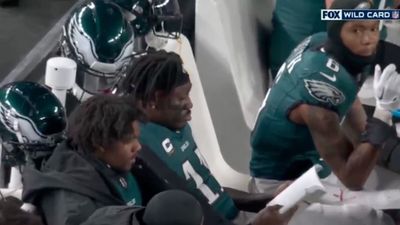 A.J. Brown Casually Read a Book on Eagles' Sidelines During Tight Playoff Game