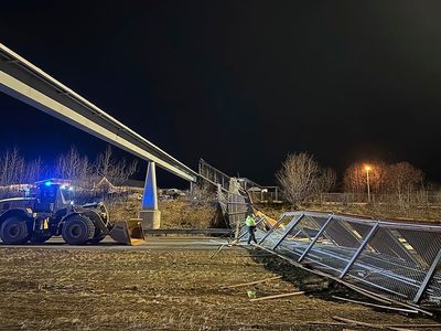 Strong winds knock down pedestrian bridge and close one of Alaska’s busiest highways