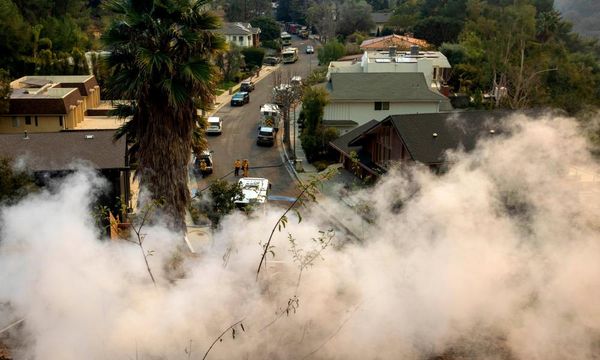 ‘We got our fingers crossed’: residents in limbo after LA fires force evacuations