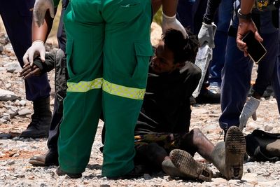 Rescuers pull survivors from South Africa mine as hundreds remain trapped