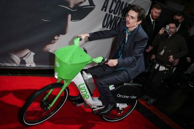 Timothee Chalamet arrives on red carpet on a Lime bike at London premiere of A Complete Unknown