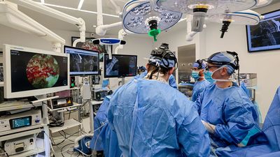 Disposable, self-cleaning, mobile camera successfully used in first-of-its-kind spinal surgery hailed as a "game changer"