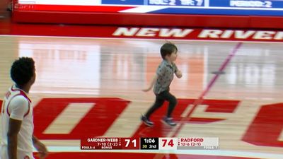 Young Fan Runs on Court During Crunch Time of Three-Point College Hoops Game