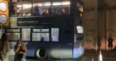 Man arrested after double-decker bus crashes into Glasgow bridge