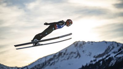 Why did a decorated female ski jumper receive toiletries and towels as a prize while her male counterpart got thousands of euros?