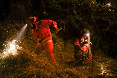 On LA fire lines, inmates shoulder heavy packs and tackle dangerous work for less than $30 a day