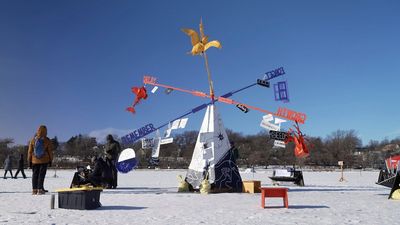 Thousands of people enjoy art on a frozen Minneapolis lake despite bone-chilling temperatures