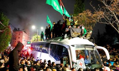 Palestinian families celebrate after prisoners released by Israel as part of Gaza ceasefire deal