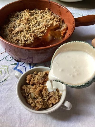 Rachel Roddy’s recipe for apple, pear and persimmon crumble