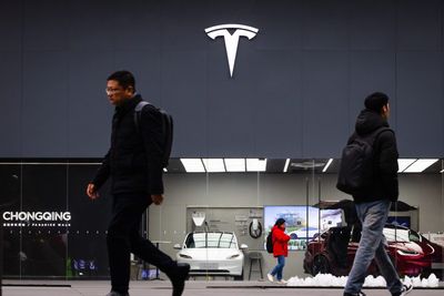 A former Tesla executive is suing the company, saying he was fired for not returning to an office more than 400 miles away