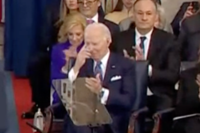 Joe Biden makes sign of the cross during Donald Trump's inauguration ceremony