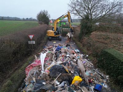 Drone footage shows mystery 40-foot rubbish mountain blocking UK road