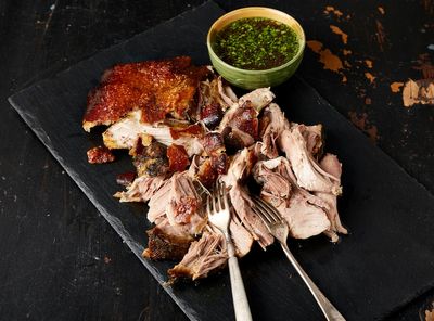 This Puerto Rican pork roast boasts tender meat and crackling, crisp skin