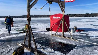 Here's How You Retrieve a Snowmobile That's Fallen Through a Frozen Lake