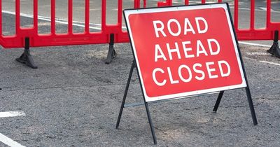 Emergency services close road in Midlothian town following a car crash