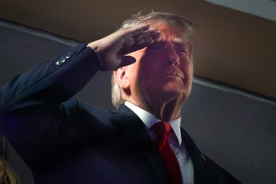 Trump keeps saluting during the national anthem – despite flag code regulations saying he shouldn’t