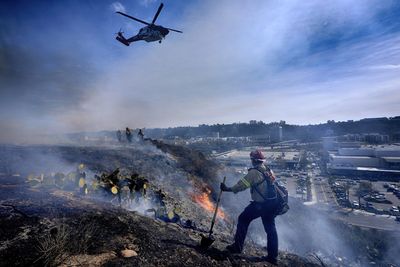 California faces more fire risk and strong winds but potential rain coming over the weekend