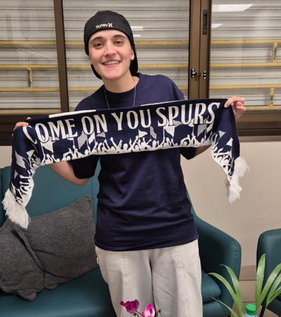 Freed Israeli hostage Emily Damari holds Tottenham scarf aloft as she thanks club and fans for their support