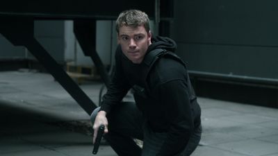 The Night Agent season 2 star teases the incredible action that they couldn't "get away with" on the first season of the Netflix show, which did lead to some on-set injuries