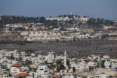 Why has US President Trump removed sanctions on Israeli settlers?