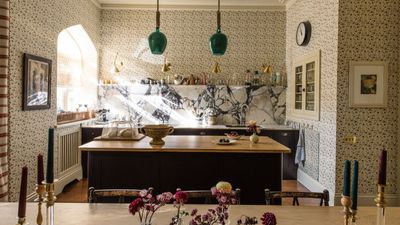 It's hard to make wallpaper work in a kitchen – but this stylish, pattern drenched space proves that mixing function and florals is always a good idea