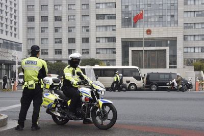 Chinese court sentences man to death over knife attack at a Japanese school bus stop