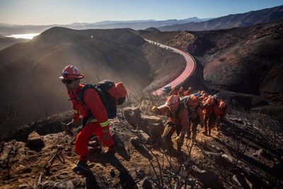 Californians hope rain will bring respite from LA wildfires as Trump set to visit