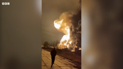 Horrifying Video Shows Civilians Fleeing Giant Explosion After Reported Ukrainian Drone Strike Hits Russian Oil Refinery