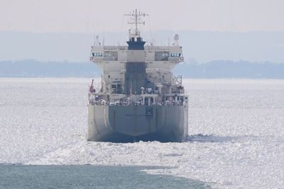 Freighter remains stuck in Lake Erie ice as crews rush to free vessel with 17 aboard