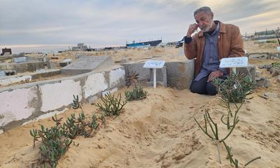 ‘He left for paradise’: hastily dug graves are visited as Gaza ceasefire takes effect