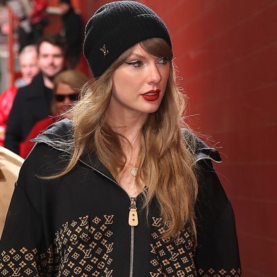 Taylor Swift Accentuates a $5,000 Louis Vuitton Jacket With Bright Red Tights at the Chiefs' AFC Championship Game