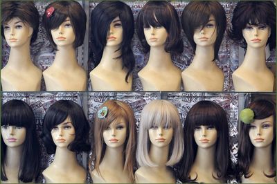 Array of Wigs' Seized From Elderly Woman Accused of Taking Citizenship Tests For More Than a Dozen Applicants