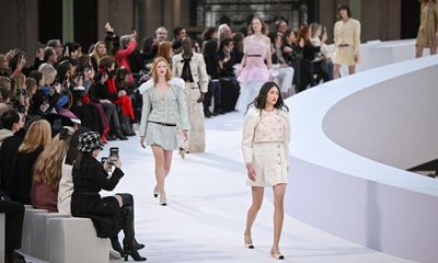 Chanel realigns its logo with bridging catwalk at show focused on timeless skirt suit