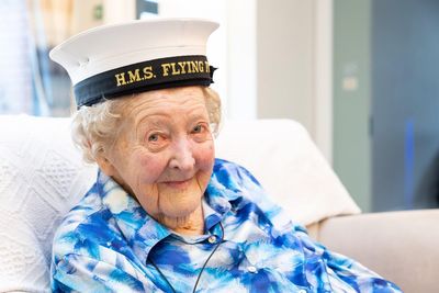 Former headmistress presented with Naval cap to celebrate 100th birthday