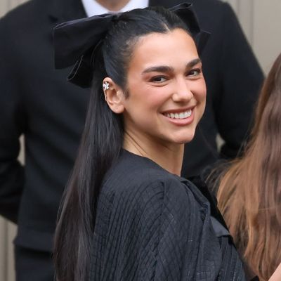 Dua Lipa Single-Handedly Revives the Coquette Trend With a Dramatic Chanel Cape and Even Bigger Hair Bow