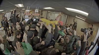 Watch: Punk band Knuckleheadz take over McDonald's and play 'F*** McDonaldz' as Ronald McDonald crowd surfs