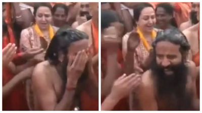 Kumbh Mela: Hema Malini shares a laugh with Baba Ramdev as his hair toss slaps another Sadhu in the face - WATCH