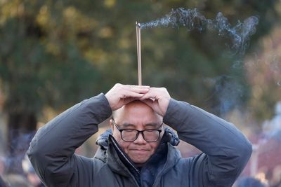 AP PHOTOS: Lunar New Year prayers and incense usher in the Year of the Snake