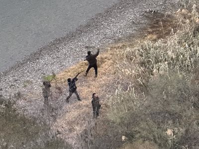 Drone Images Show Armed Cartel Smugglers Open Fire on U.S. Border Patrol in Texas