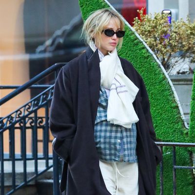 Jennifer Lawrence Pairs New Balance Sneakers and a Perfect Black Coat for a Shopping Spree at The Row